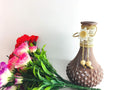 Go Hooked brown painted glass flower vase with decorative burlap and button accent. Includes artificial flowers.