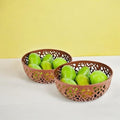 GoHooked brown plastic fruit bowls with intricate cutout design, holding green fruits. Set of 2.