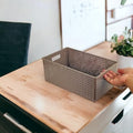 GoHooked brown plastic storage basket with a perforated design, ideal for cosmetics, office supplies, or fruit.