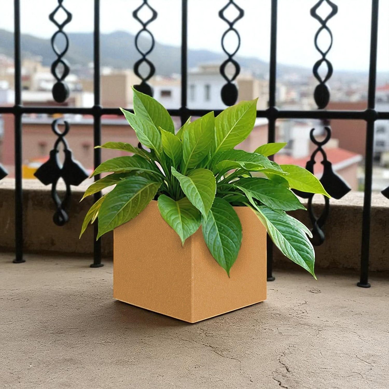 GoHooked 8-inch modern brown polymer cube planter with a green plant on a balcony.