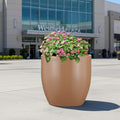GoHooked Pluto 20-inch brown polymer planter pot with pink flowers, modern round design, lightweight and durable.