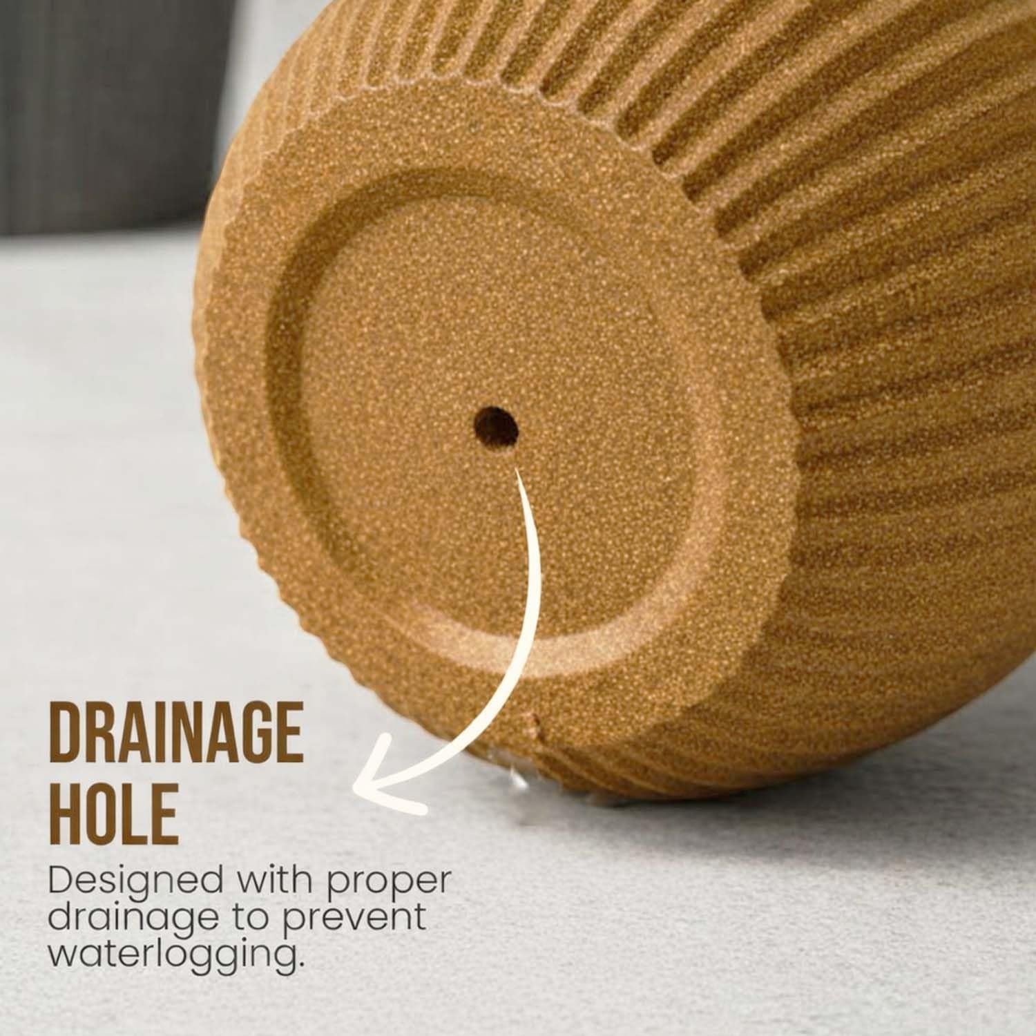 GoHooked brown polymer planter with ribbed design and drainage hole, includes saucer tray for indoor/outdoor plants.