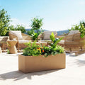 GoHooked brown rectangular polymer planter pot filled with lush green plants and small yellow flowers. Modern outdoor garden decor.