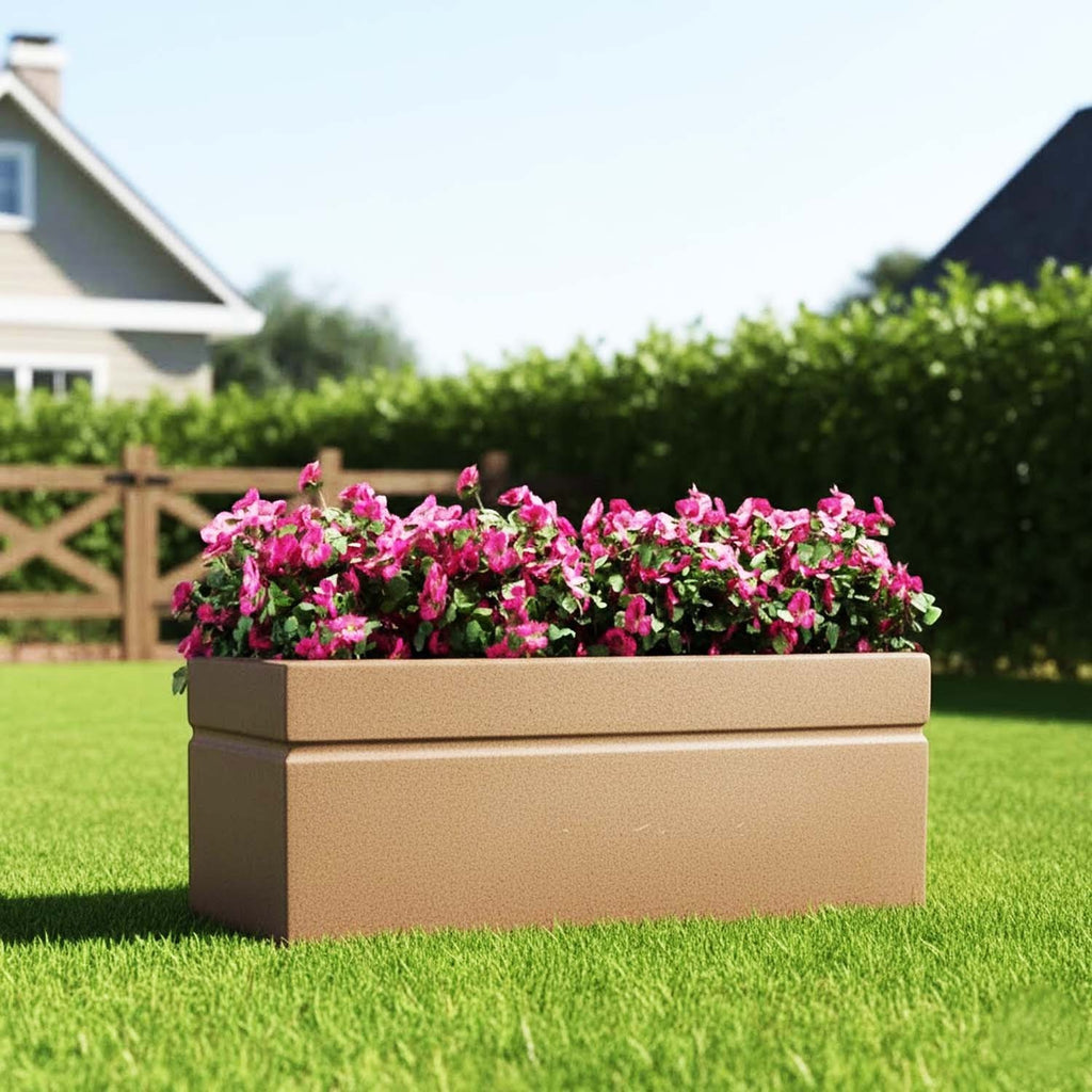GoHooked brown rectangular polymer planter pot filled with pink flowers on a green lawn in a garden setting