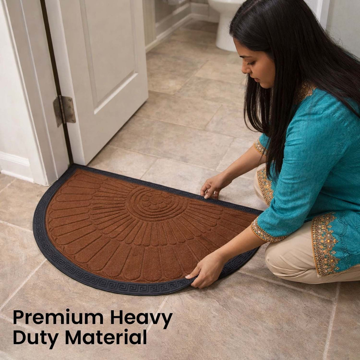 GoHooked semi-circle rubber door mat in royal brown with black border, placed at a home entrance by a woman.