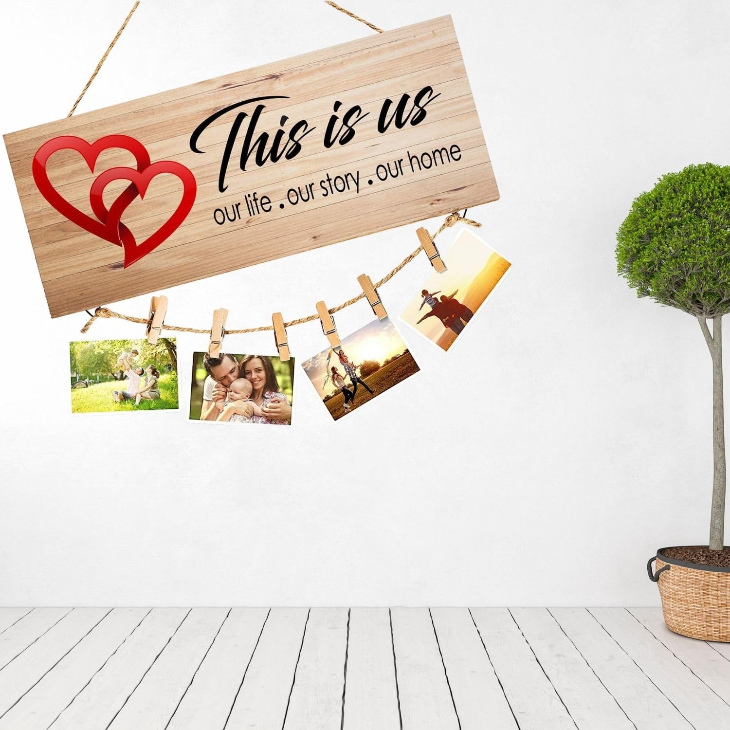 GoHooked brown MDF wood "This is Us" sign with red hearts and twine for hanging photos. Rustic farmhouse decor.