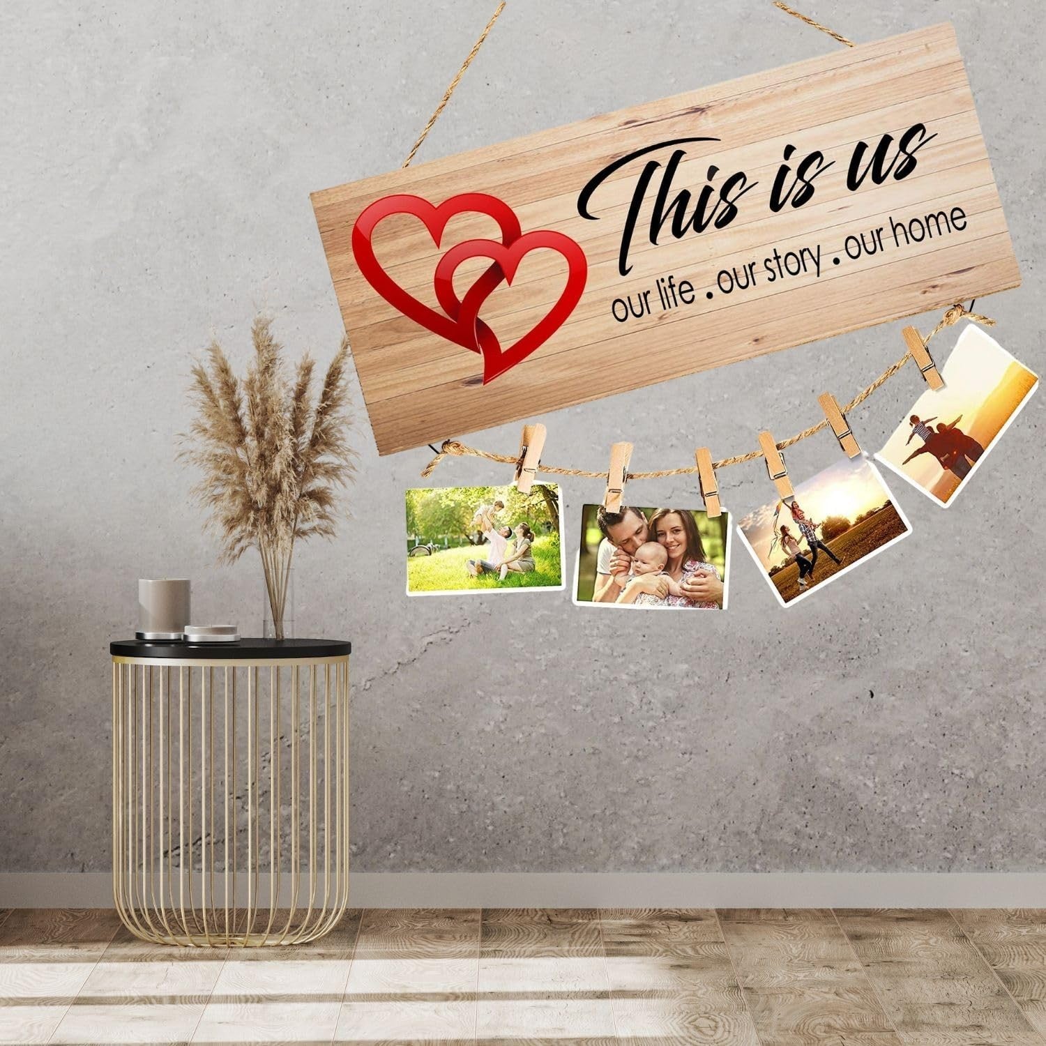 GoHooked brown MDF wood sign with red hearts and "This is us" quote, holding photos with clips and twine.