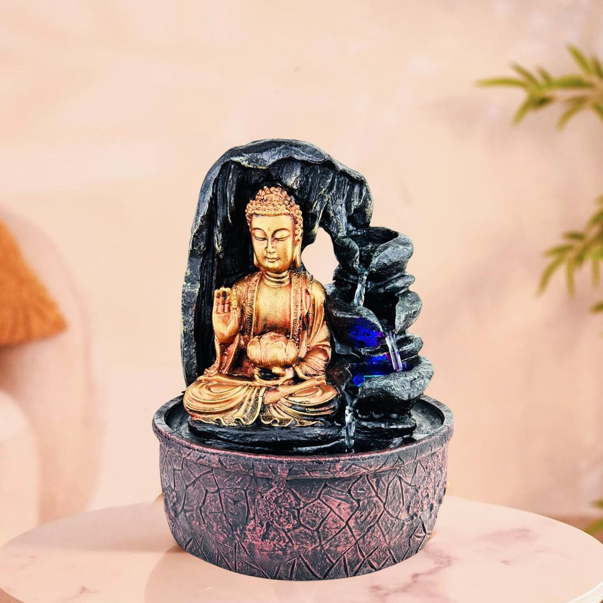 GoHooked Lord Buddha tabletop fountain with LED lights and adjustable water flow, made of polyresin.