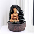 GoHooked Lord Buddha tabletop fountain with LED lights, adjustable water flow, and polyresin construction. Features a meditating Buddha figure with a lotus flower.