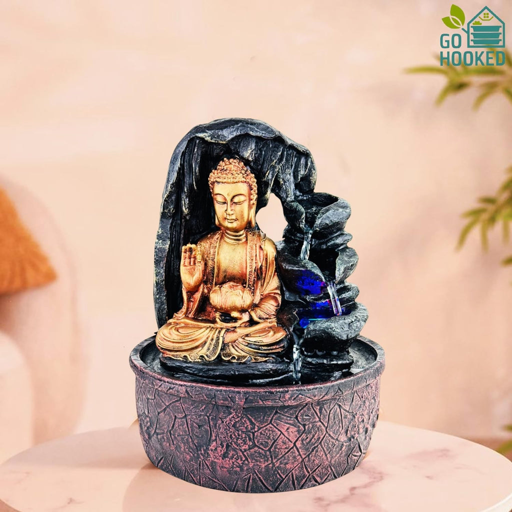 Go Hooked golden Buddha fountain with cascading water and blue LED lights, made of polyresin.