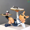 Go Hooked black and white polyresin bulldog statue with gold trays holding perfume and remote. Decorative sculpture.