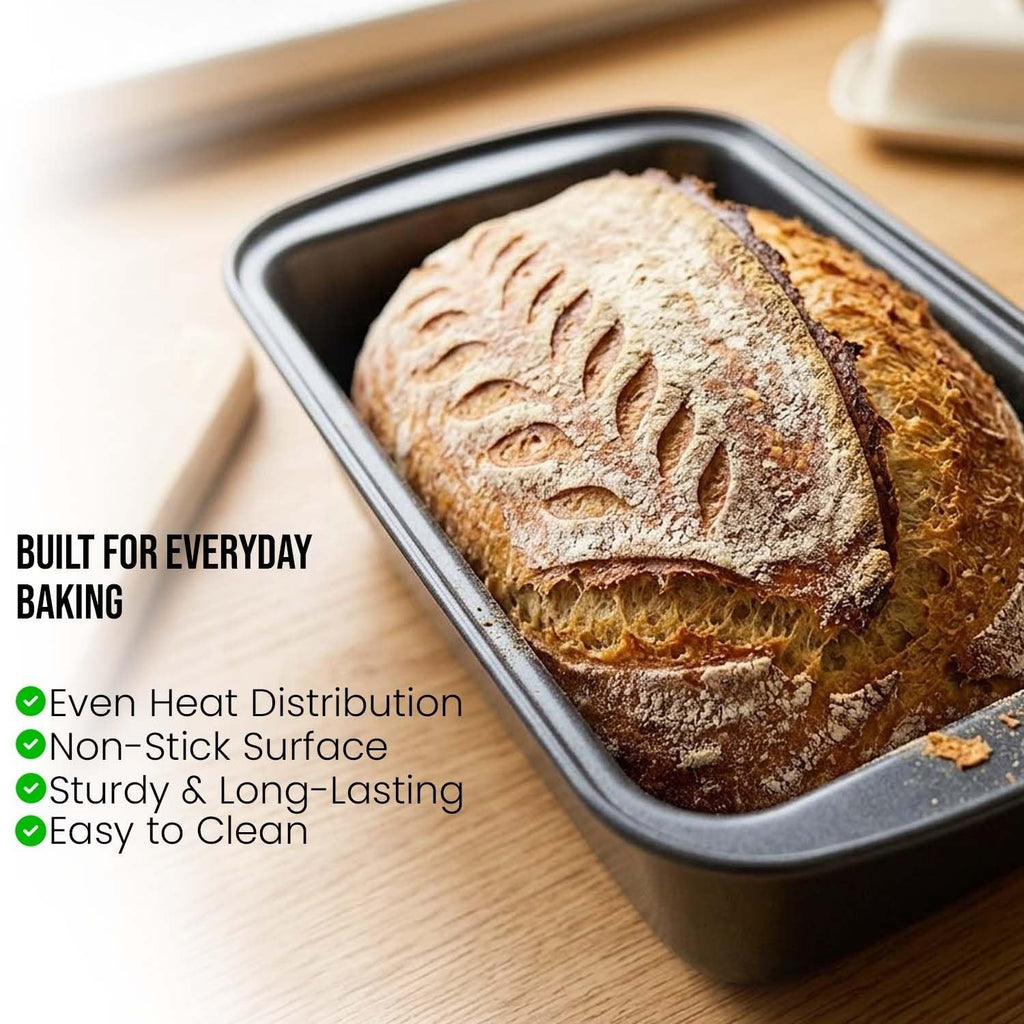 GoHooked grey carbon steel loaf pan with a beautifully scored loaf of bread inside.