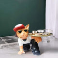 GoHooked black and white cat figurine wearing sunglasses and a red hat, holding a gold tray with cosmetics.