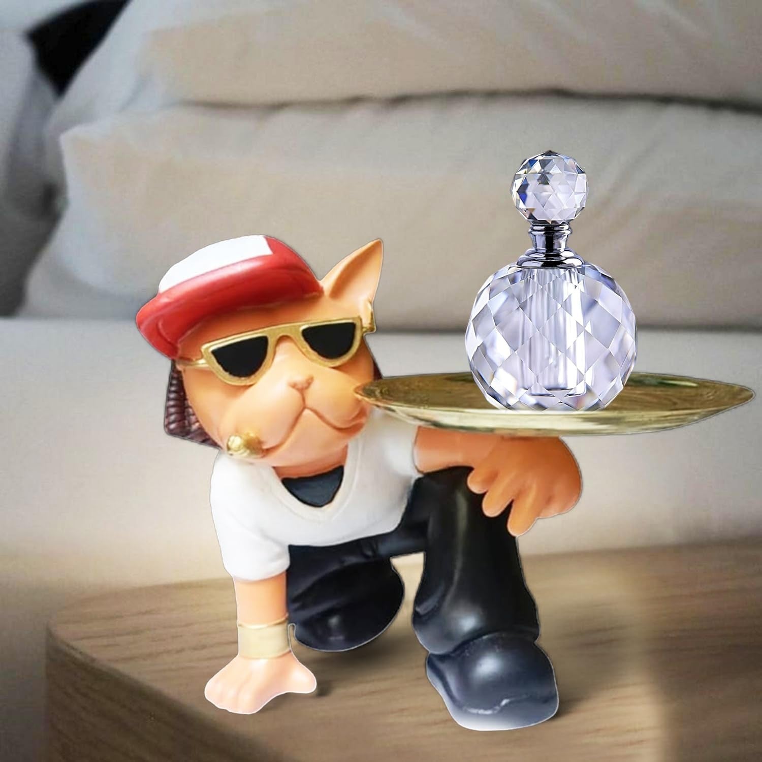 GoHooked black and white cat figurine wearing sunglasses and a hat, holding a gold tray with a crystal bottle.