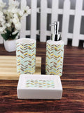Go Hooked 3-piece ceramic bathroom set with a chevron pattern in mint green, brown, and yellow. Includes soap dispenser, cup, and soap dish.