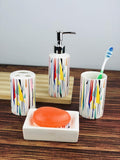 GoHooked 4-piece ceramic bathroom set with abstract colorful geometric pattern. Includes soap dispenser, tumbler, toothbrush holder, and soap dish.