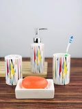 GoHooked 4-piece ceramic bathroom set with abstract colorful geometric pattern. Includes soap dish, dispenser, tumbler, and toothbrush holder.