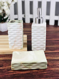 Go Hooked 3-piece ceramic bathroom set with soap dispenser, toothbrush holder, and soap dish in a marbled white, green, and pink design.