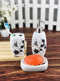 Go Hooked 3-piece ceramic bathroom set with floral design, includes soap dish, toothbrush holder, and dispenser. White with black and grey floral accents.