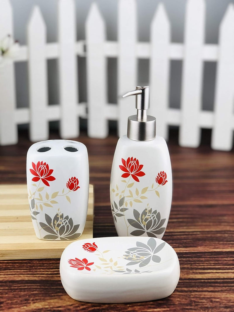 GoHooked white ceramic 3-piece bathroom set with red floral and grey leaf design. Includes soap dispenser, toothbrush holder, and soap dish.