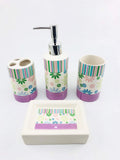 GoHooked 4-piece ceramic bathroom set with floral print, featuring a soap dispenser, toothbrush holder, tumbler, and soap dish in pastel colors.