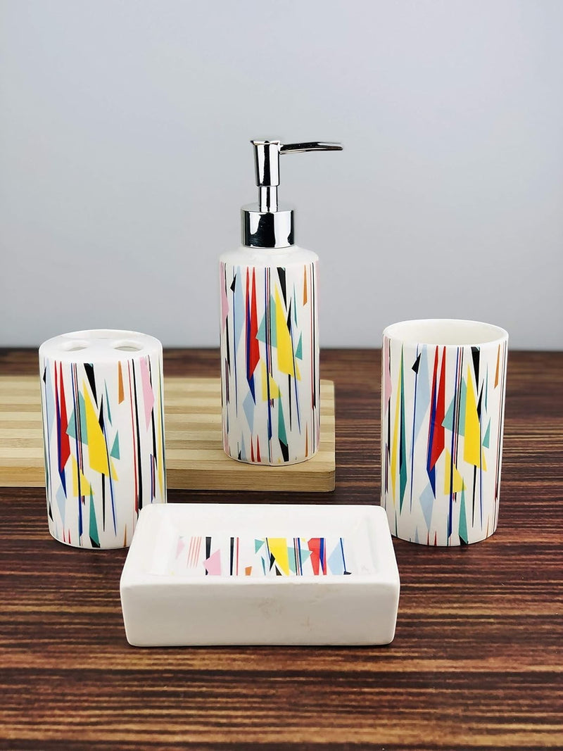 GoHooked 4-piece ceramic bathroom set with a colorful abstract geometric pattern. Includes soap dispenser, tumbler, toothbrush holder, and soap dish.