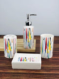 GoHooked 4-piece ceramic bathroom set with a colorful abstract geometric pattern. Includes soap dispenser, tumbler, toothbrush holder, and soap dish.