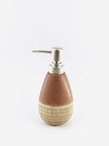 Go Hooked brown and beige ceramic soap dispenser with textured base and silver pump.