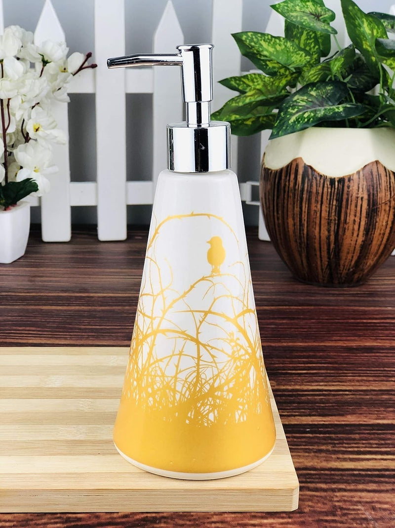 Go Hooked white ceramic soap dispenser with gold bird and branch design, 300ml capacity.