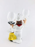 GoHooked white resin chef wine glass holder with red scarf and yellow cloth detail. Holds two glasses.