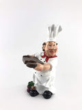 Go Hooked white resin chef figurine holding a platter, a fun kitchen decor piece.