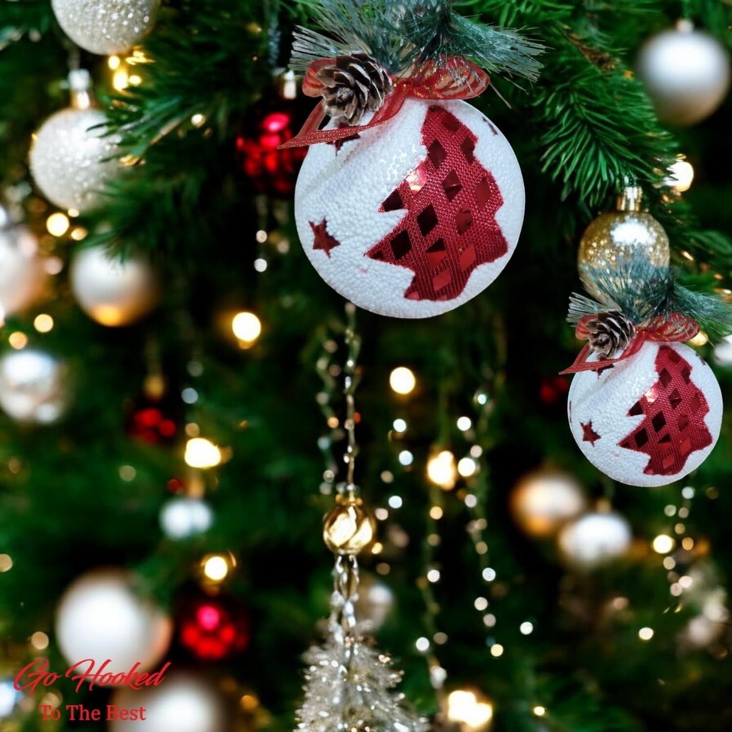 Go Hooked white Christmas ball ornaments with red glitter trees and pinecone detail. Pack of 3.