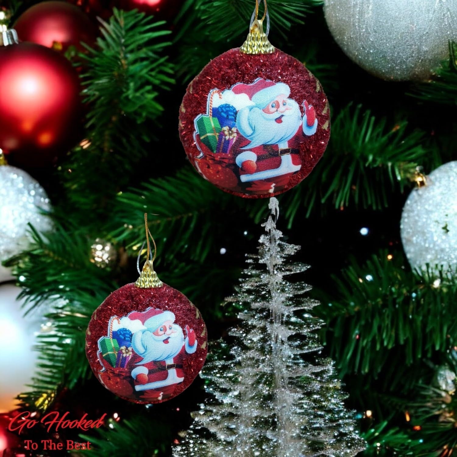 Go Hooked multicolor glitter Christmas ornaments with Santa Claus design hanging on a tree.