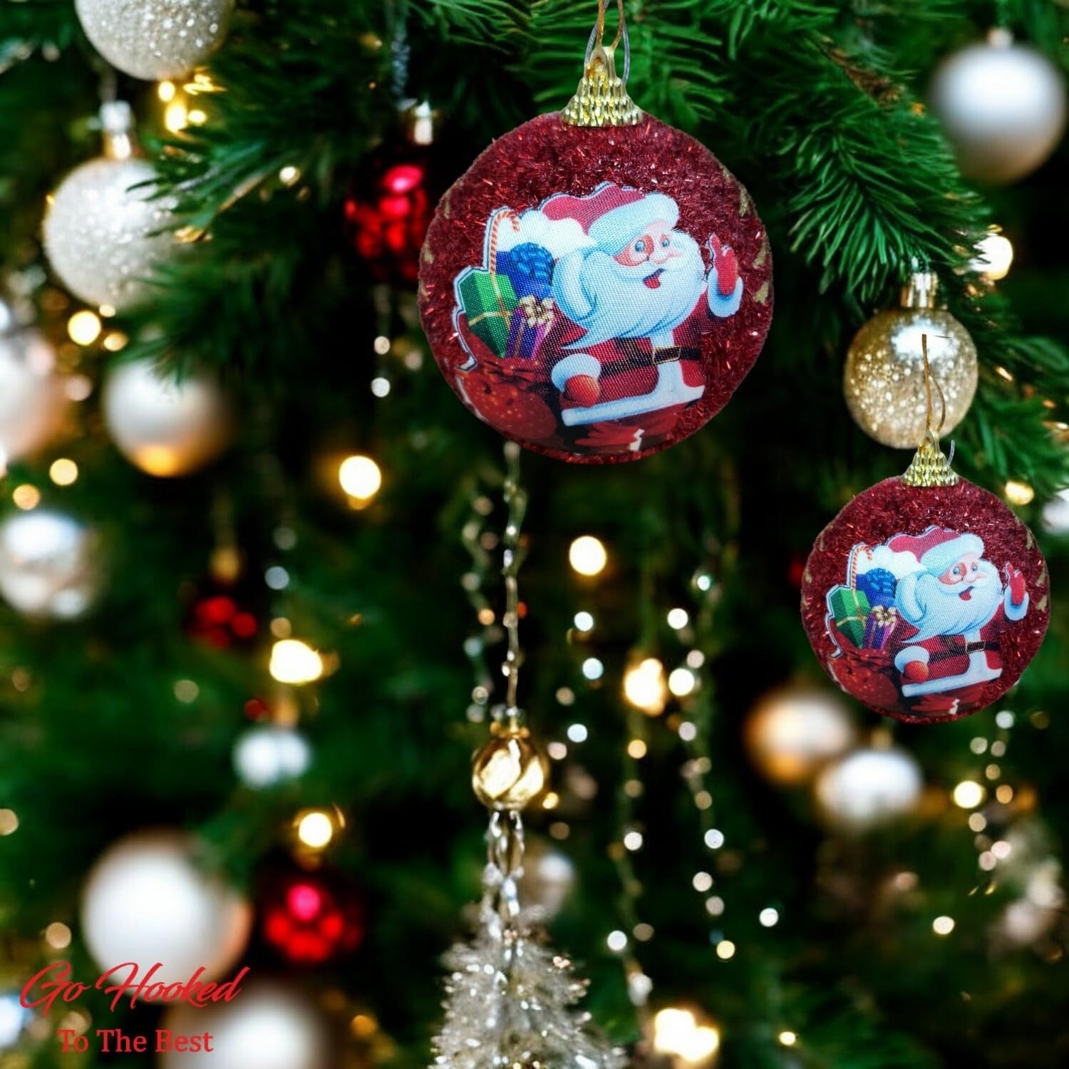 GoHooked red glitter Christmas ornaments featuring Santa Claus with gifts, hanging on a decorated tree.