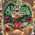 GoHooked green Christmas wreath with "Merry Christmas" text, red berries, gold accents, and a red bow.