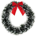 GoHooked 20cm artificial pine Christmas wreath with a red bow, dusted with white accents. Indoor wall and door decor.