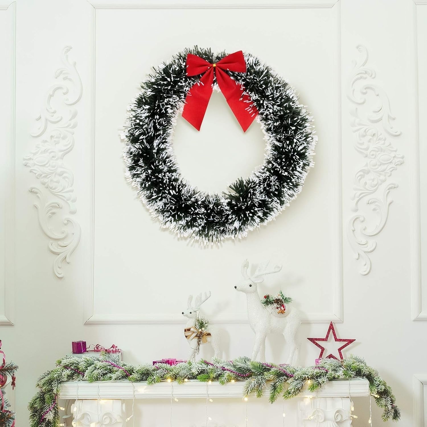 Go Hooked 20cm artificial pine Christmas wreath with red bow, green and white tinsel, indoor wall decor.