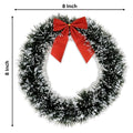 GoHooked 8-inch artificial pine Christmas wreath with a red bow, green and white tinsel, indoor wall decor.