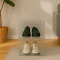 GoHooked clear acrylic stackable shoe boxes with magnetic front door, holding black loafers and white sneakers.