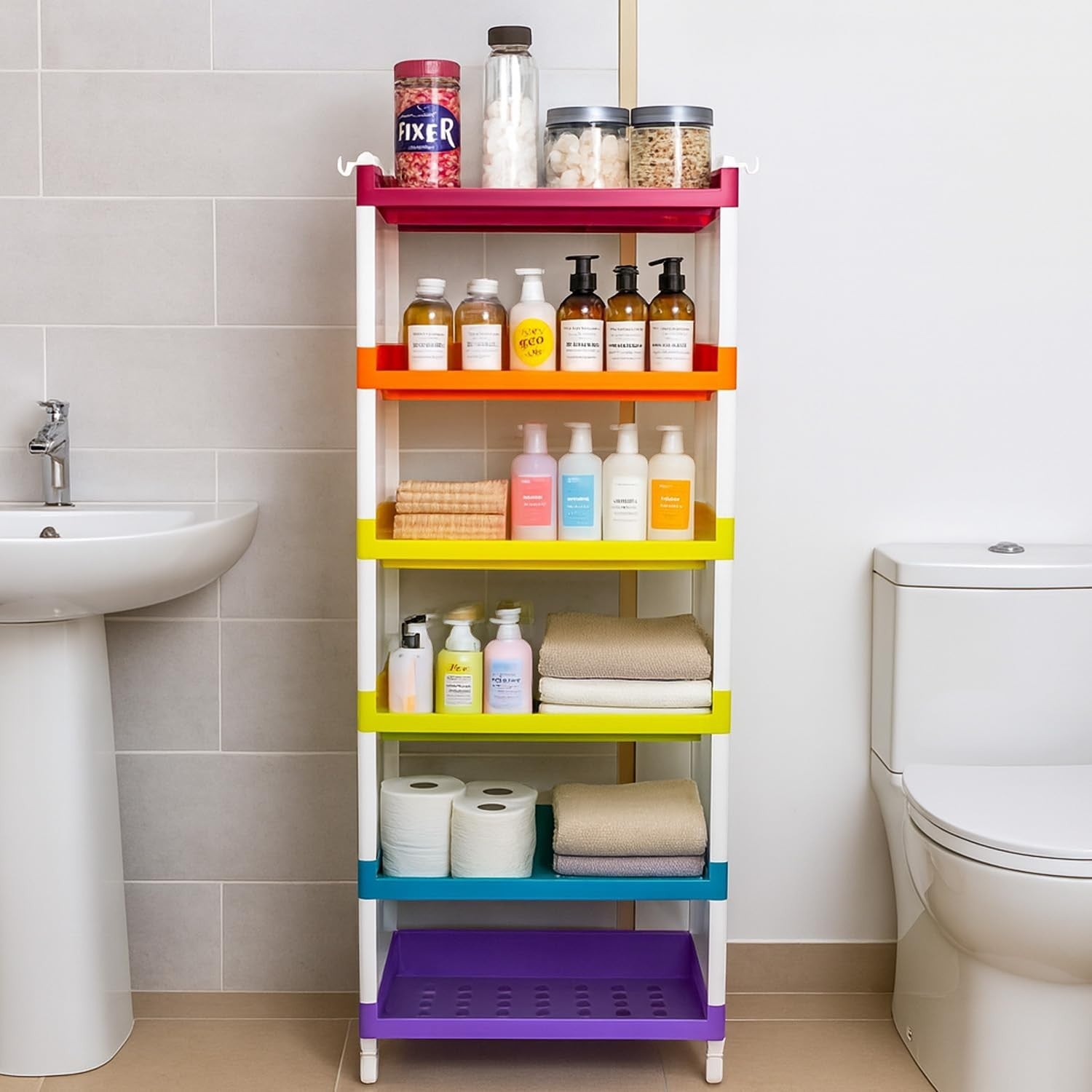 GoHooked 6-tier multipurpose storage rack with colorful shelves holding toiletries, towels, and toilet paper in a bathroom.