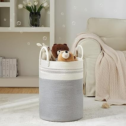 GoHooked cotton rope laundry basket in grey and white with sturdy handles, filled with plush toys in a cozy living room.