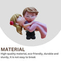 GoHooked romantic couple figurine of groom carrying bride in pink dress, resin material, ideal for cake decoration or home decor.