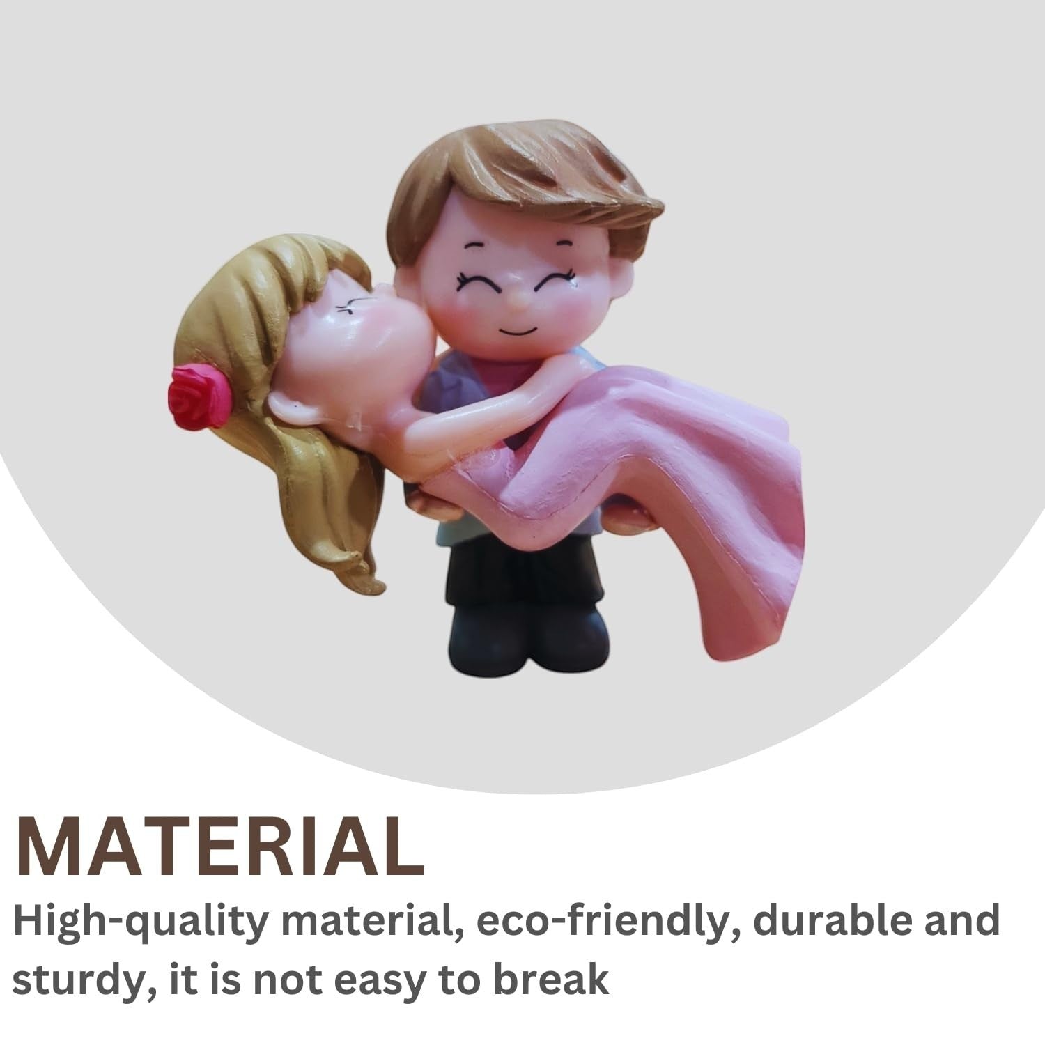 GoHooked romantic couple figurine of groom carrying bride in pink dress, resin material, ideal for cake decoration or home decor.