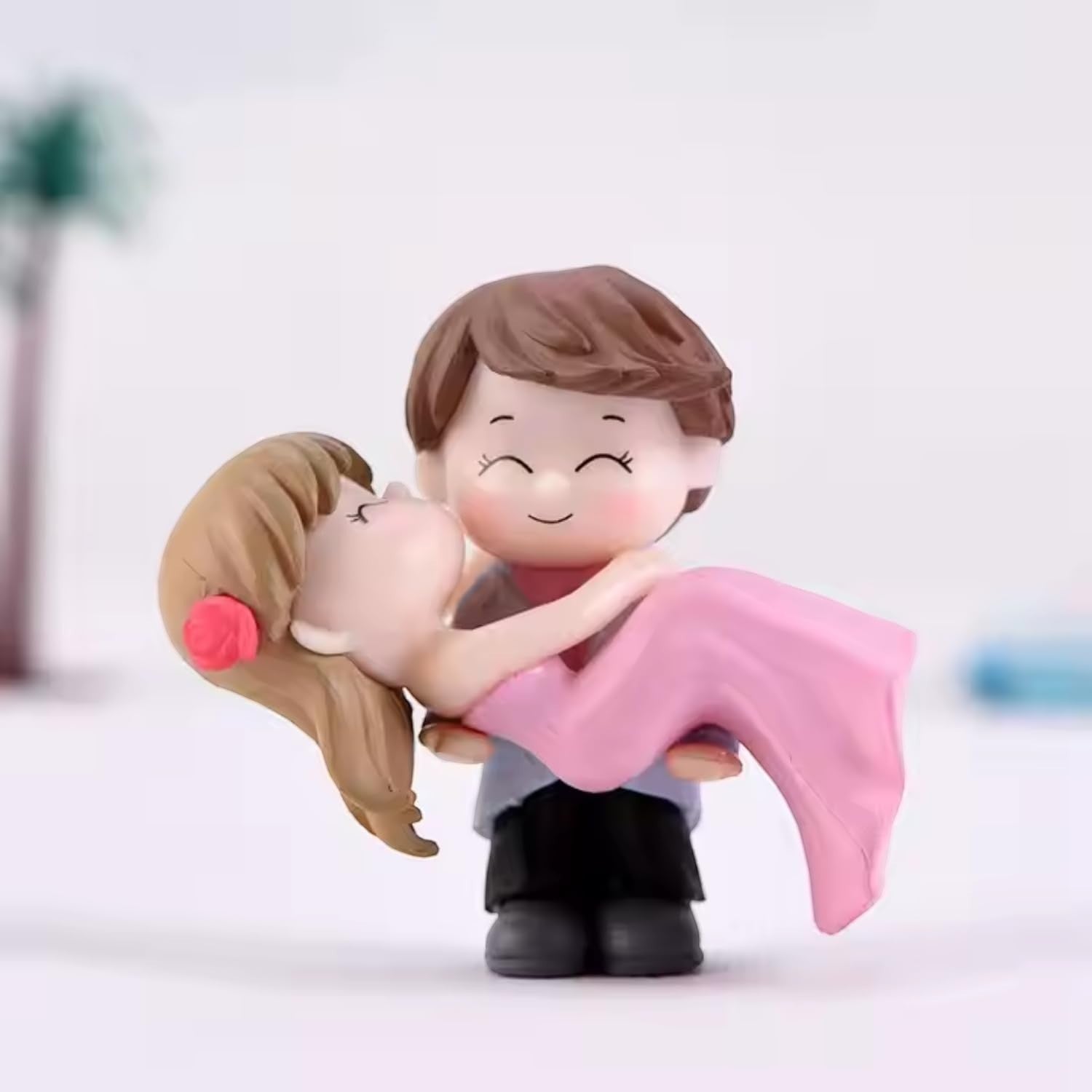 GoHooked romantic couple figurine of groom carrying bride in pink dress, resin, for cake decor or home.