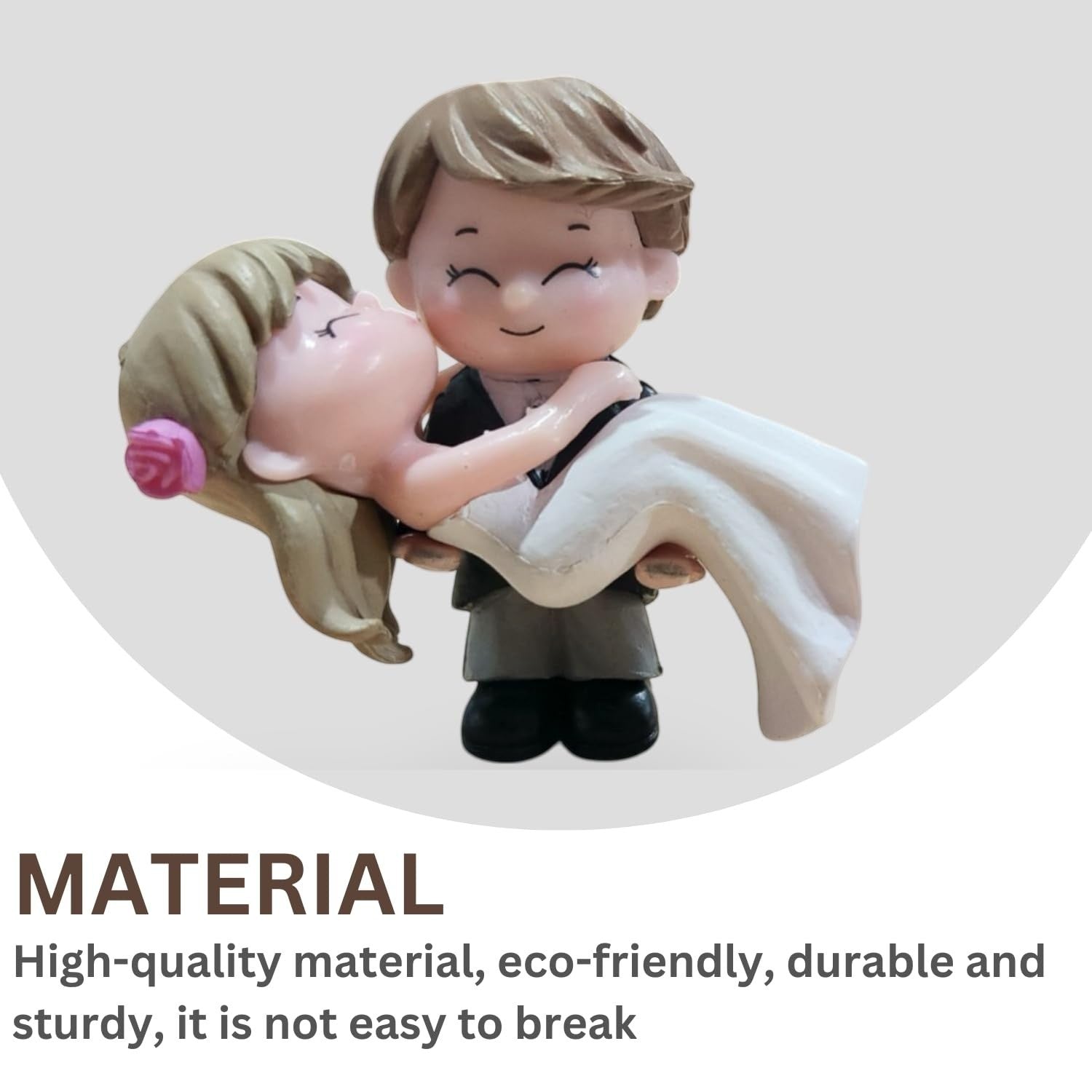 Go Hooked romantic bride and groom figurines in resin, bride kissing groom, white dress, pink rose detail.