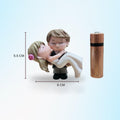 Go Hooked romantic bride and groom figurines in black and white, made of resin. Bride wears a pink flower in her hair.