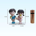 GoHooked resin couple figurines holding ice cream, boy in blue shirt, girl in pink dress. Ideal for cake decor.