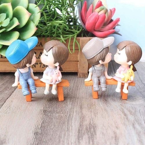 GoHooked resin couple figurines sitting on benches, one pair kissing, holding plush toys. Romantic decor.
