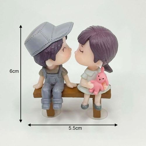 GoHooked resin couple figurines kissing on a bench, girl holds pink bunny. Romantic decor.