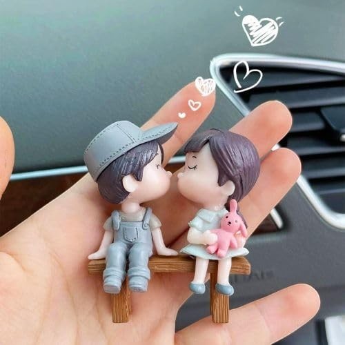 GoHooked resin couple figurines kissing on a bench, boy in grey overalls and cap, girl holding pink bunny. Romantic decor.